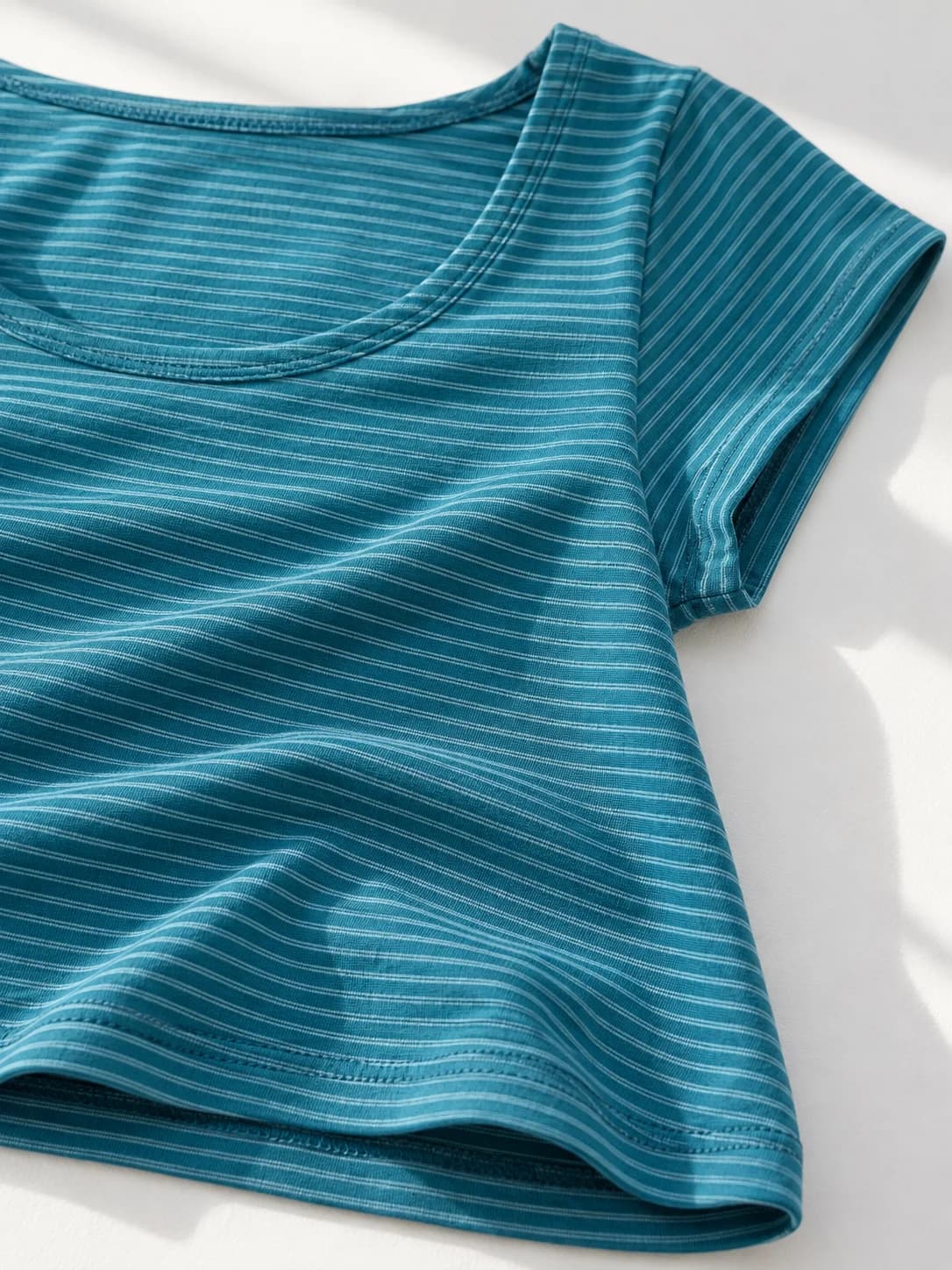 Blue fine-stripe tee — fabric
